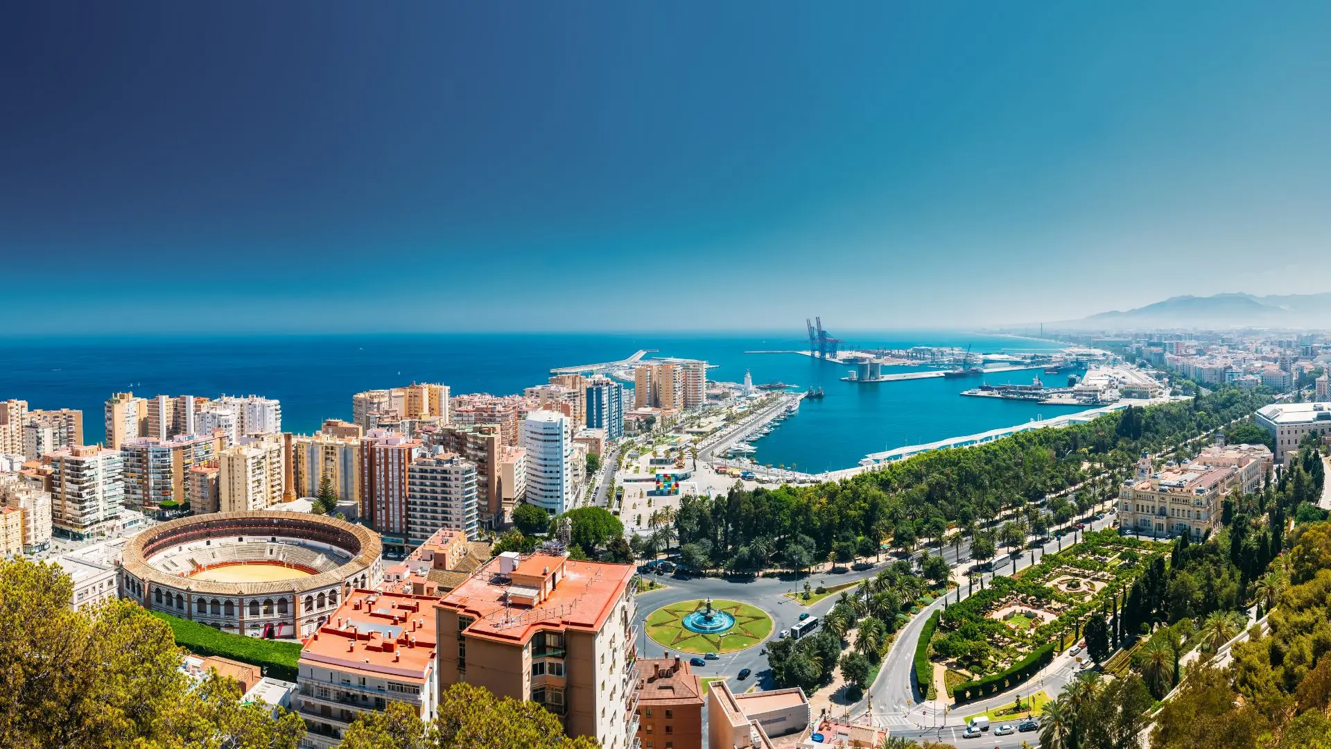 DEKRA Málaga campus and Málaga city skyline DEKRA Málaga campus and Málaga city skyline