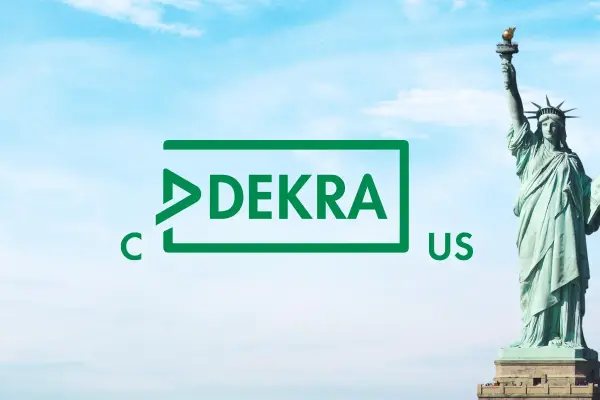 Statue of Liberty next to cDEKRAus logo