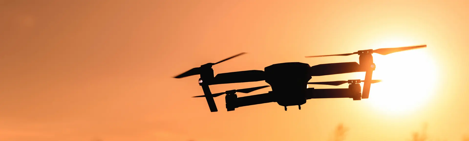 flying drone with sunset in background flying drone with sunset in background