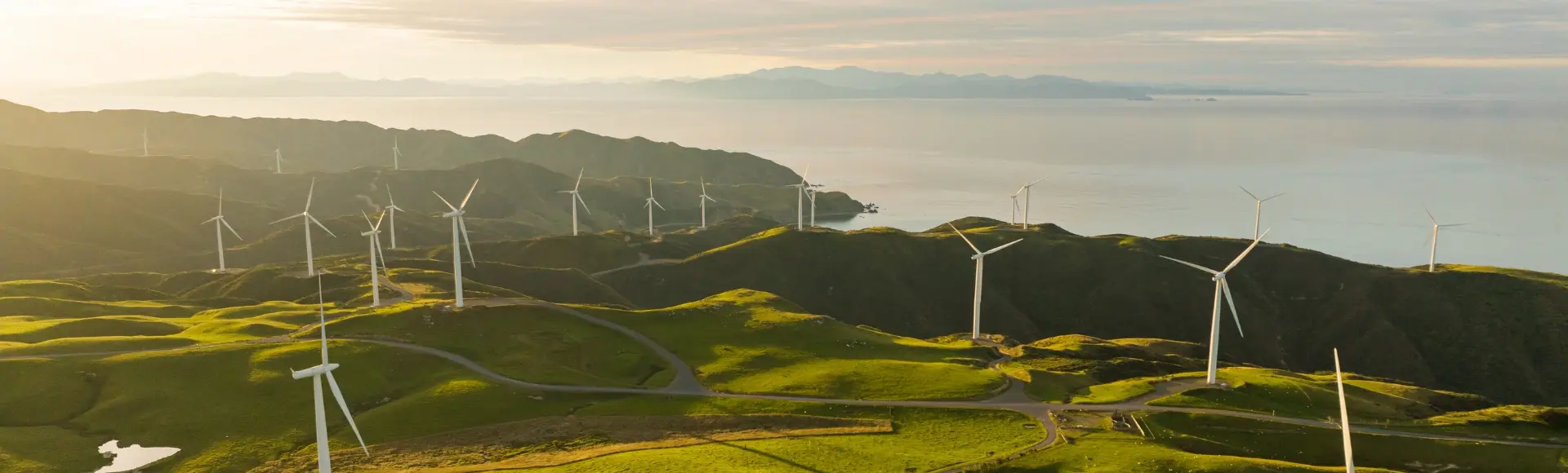 wind power turbine on land close to the sea