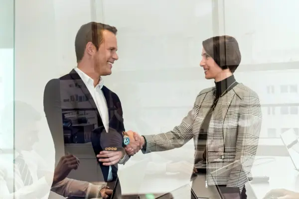 HSE manager shakes hands with colleague