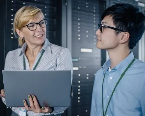 two IT colleagues in a data storageroom