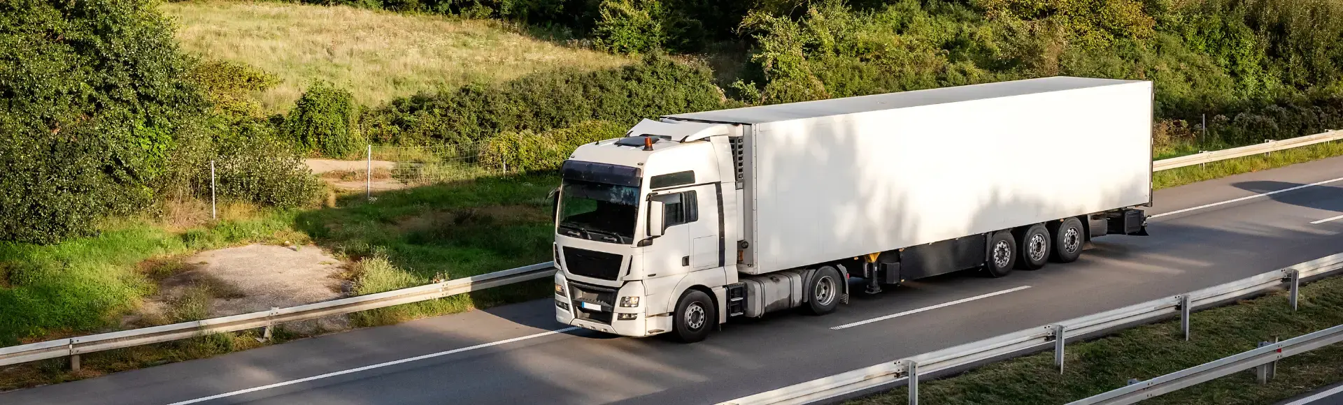 two construction workers side by side with helmet in hand