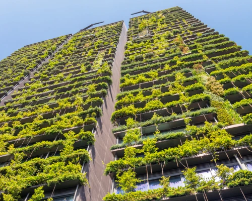 Office building with green plants on every balcony Office building with green plants on every balcony
