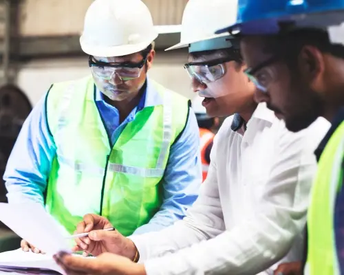 industrial employees discussing a safety plan