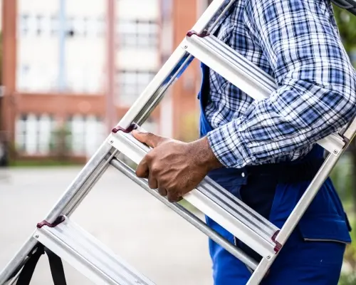 Construction worker holds Safety Culture Ladder step 2