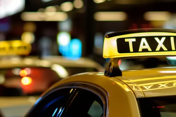 Yellow taxi's parked one after another on the road