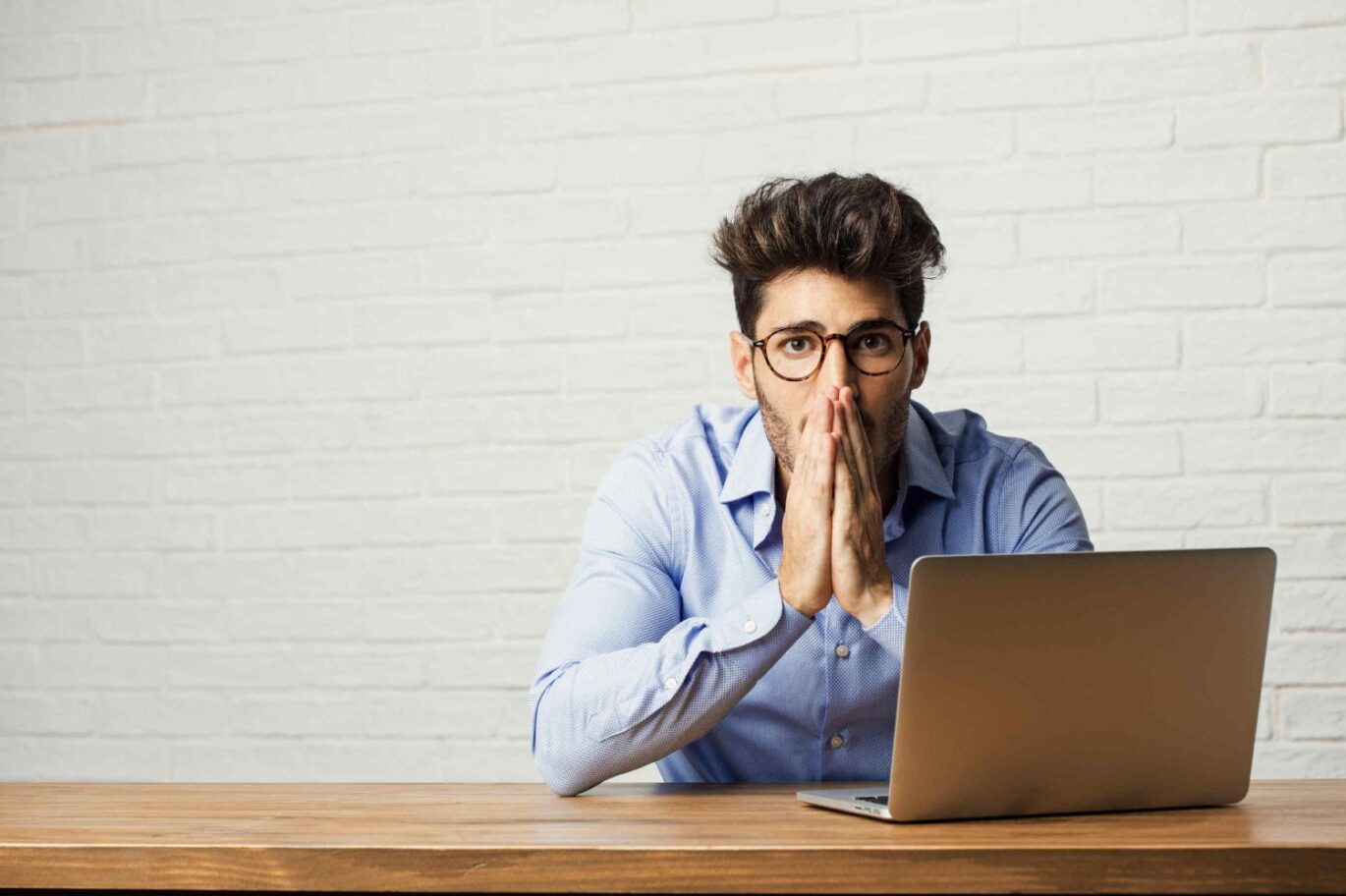 man infront of a laptop