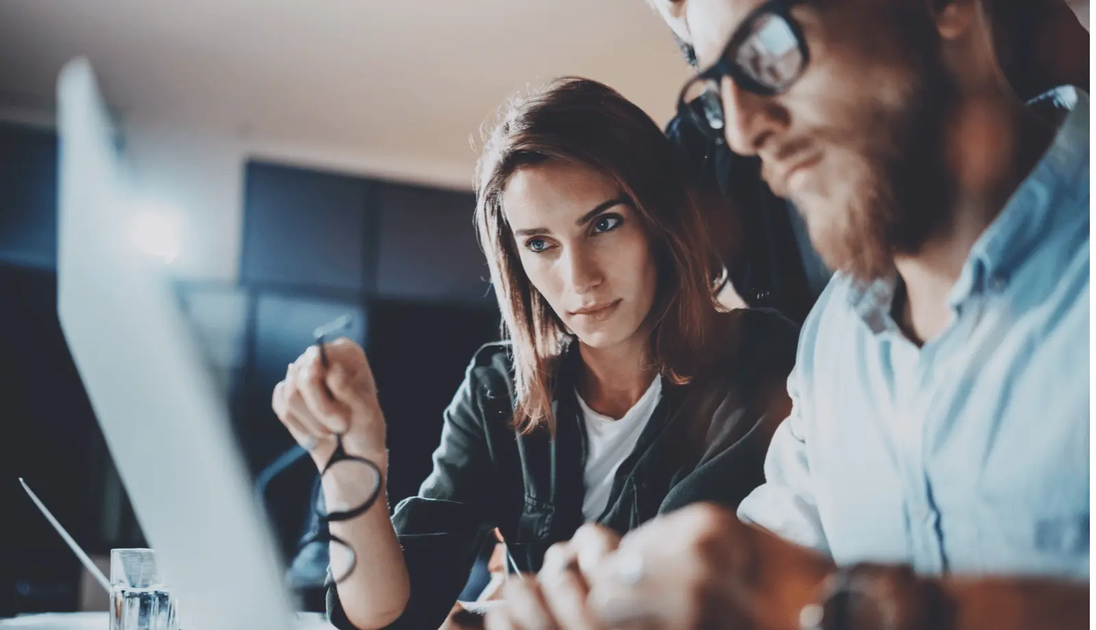 Two people looking at a computer