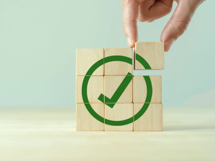 wood cubes with a green check mark