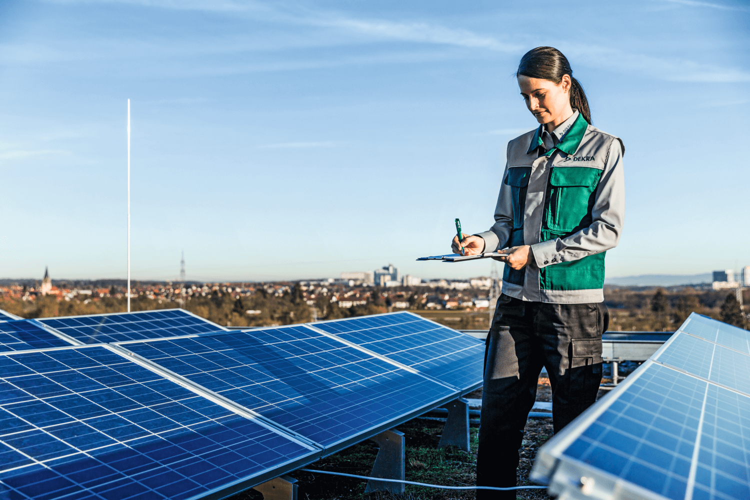 woman checking solar panel woman checking solar panel