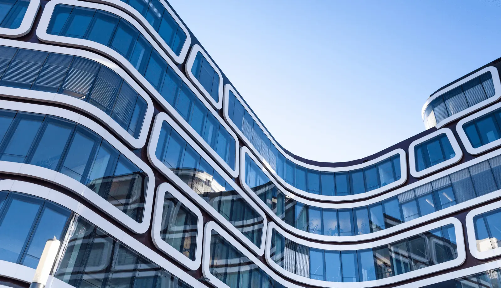 Black and white façade of a modern office building in Germany.