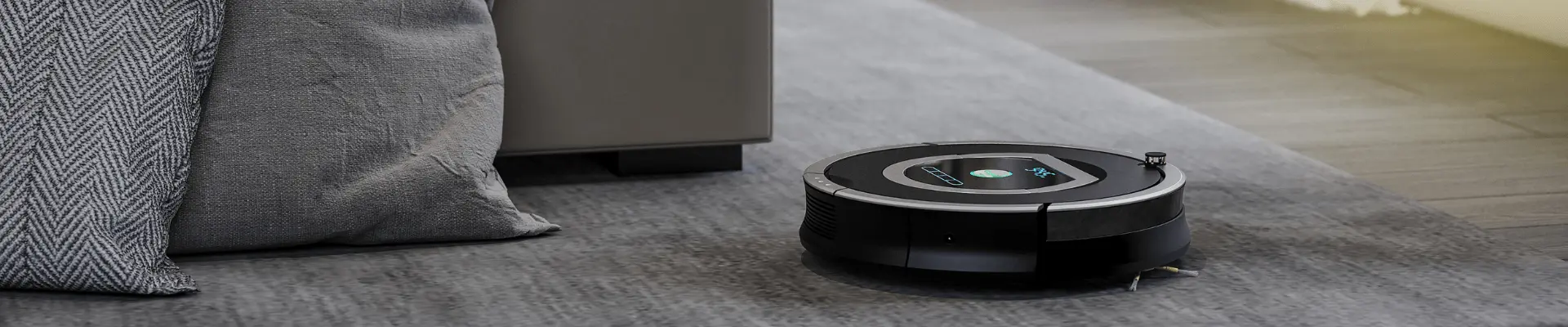 Robot vacuum cleaner on carpet in living room floor