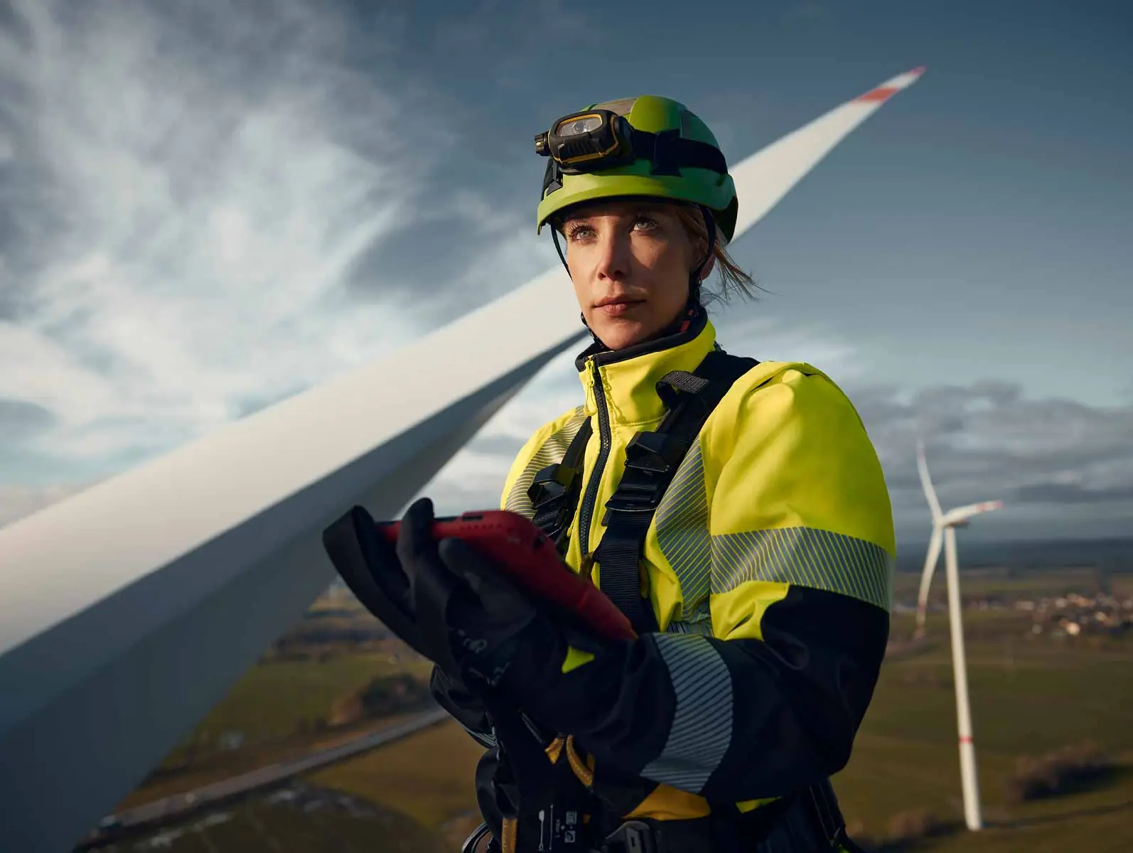 DEKRA Inspection Engineer Anna-Louisa standing on a wind turbine.