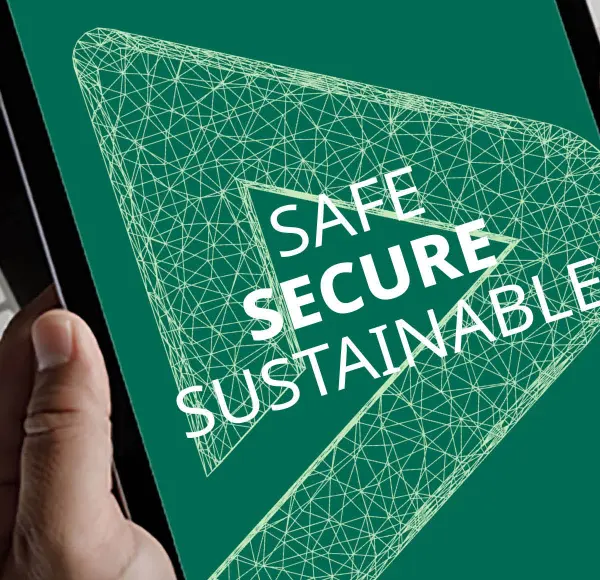 Person holding a tablet displaying the DEKRA logo with the words 'Safe, Secure, Sustainable' on a green background, emphasizing DEKRA's commitment to safety and sustainability.