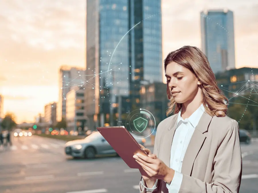 Woman holding a tablet with a city skyline and car in the background, with abstract digital connections representing connectivity and networking Woman holding a tablet with a city skyline and car in the background, with abstract digital connections representing connectivity and networking
