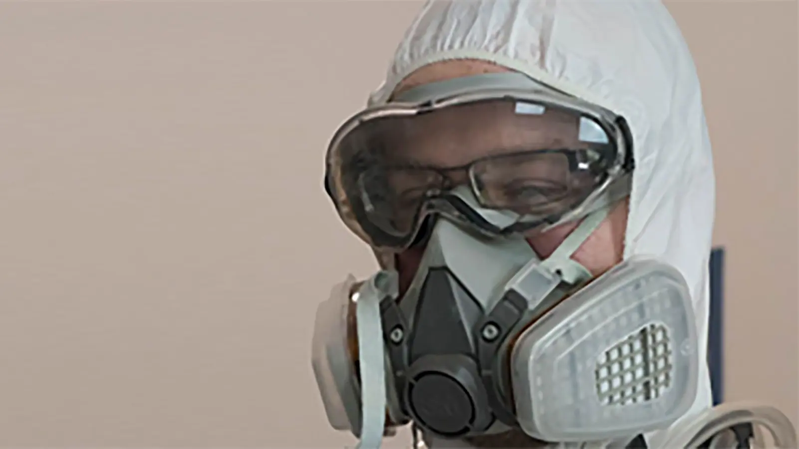 A person with an air-purifying breathing apparatus