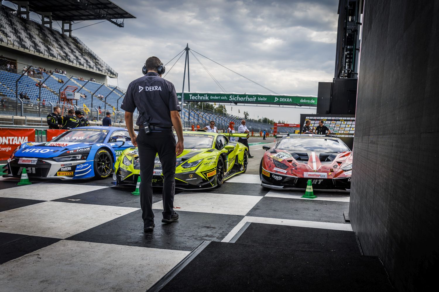 DTM racing cars and DEKRA technical commissioner