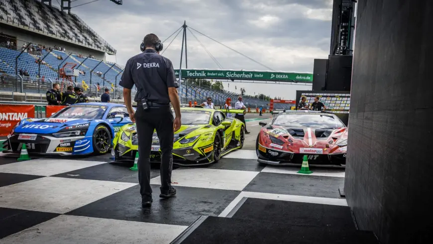 DTM racing cars and DEKRA technical commissioner