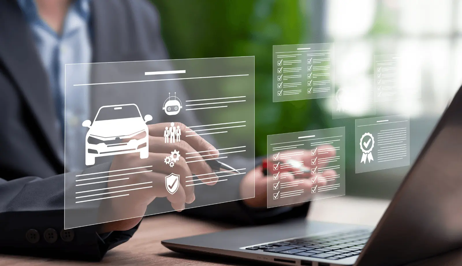 A person sits in front of a laptop, with only their hands visible. Three transparent, floating digital screens appear above the laptop, displaying a vehicle, a certification checklist, and various other icons. The person uses a pen to interact with one of the virtual screens.