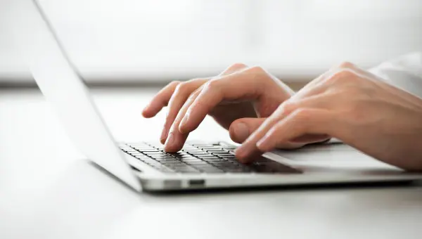 Person is typing on a laptop Person is typing on a laptop