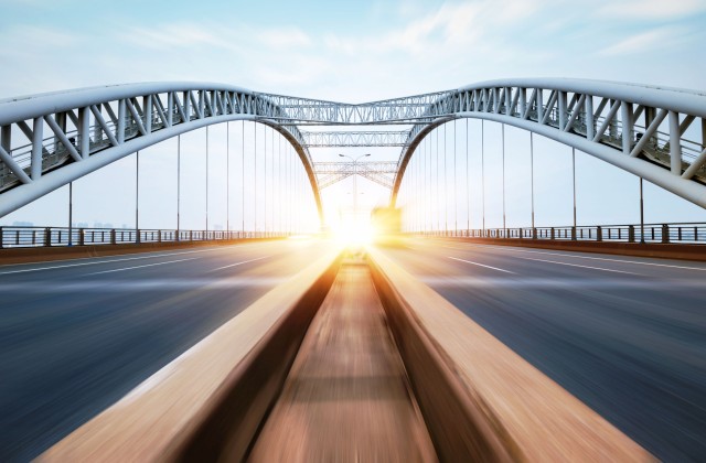 A bridge leading into the sunset.