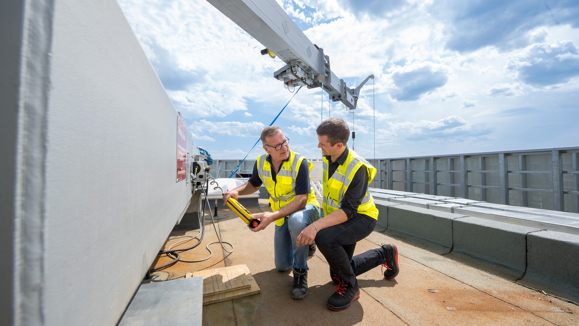 Two engineers on the rooftop of the Porsche tower