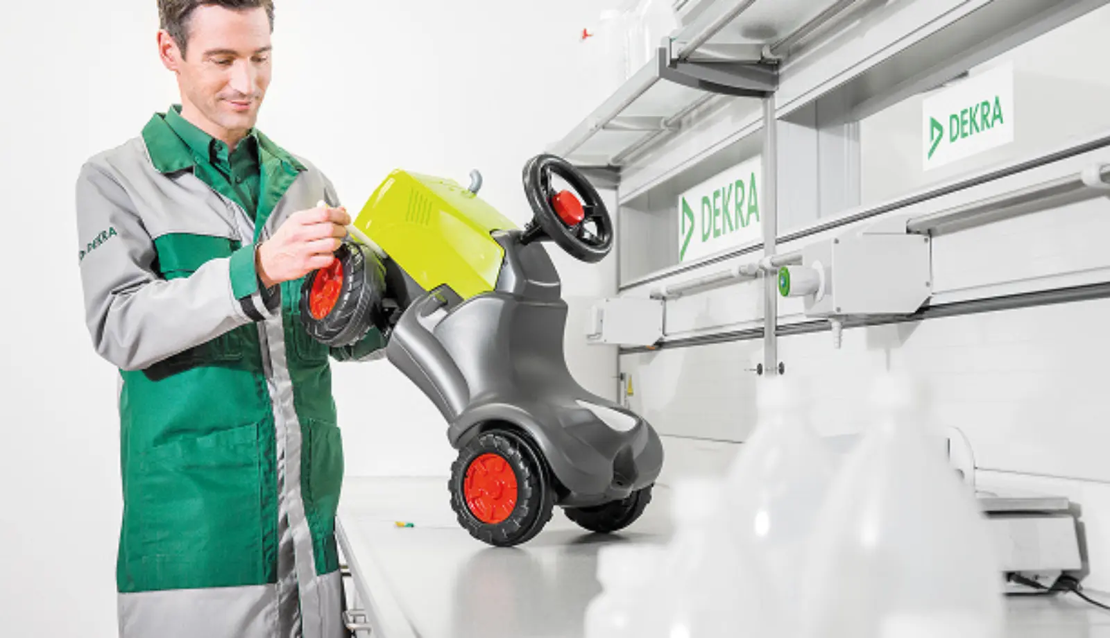 DEKRA technician testing a children’s ride-on toy in a lab