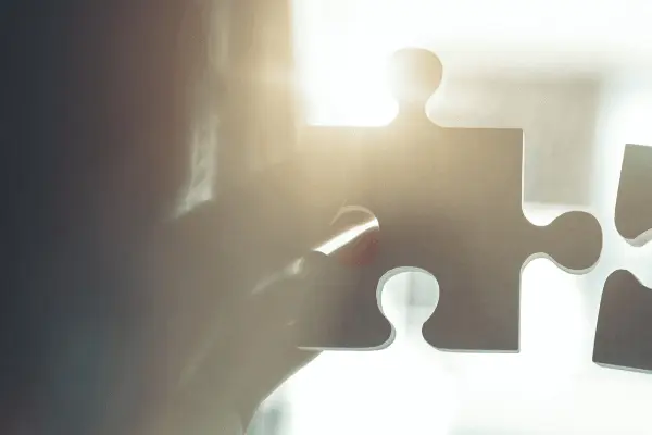 puzzle pieces with a focus light in the middle puzzle pieces with a focus light in the middle