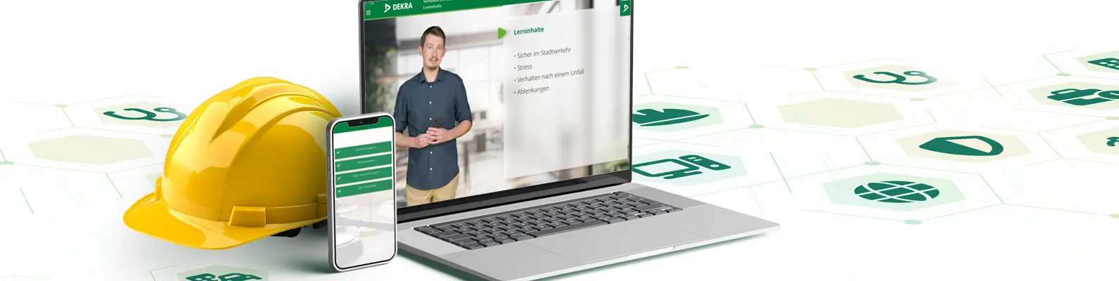 Laptop, Handy und Schutzhelm als Sinnbild für das DEKRA Safety Web