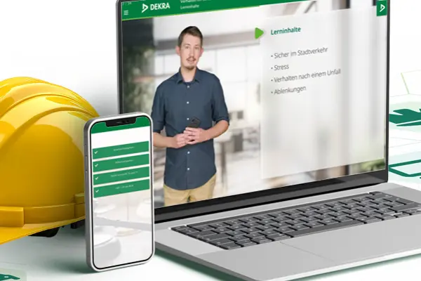 Laptop, Handy und Schutzhelm als Sinnbild für das DEKRA Safety Web Laptop, Handy und Schutzhelm als Sinnbild für das DEKRA Safety Web