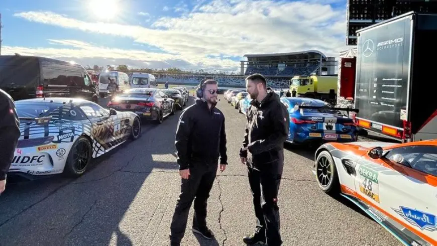 Two DEKRA inspectors next to the race track