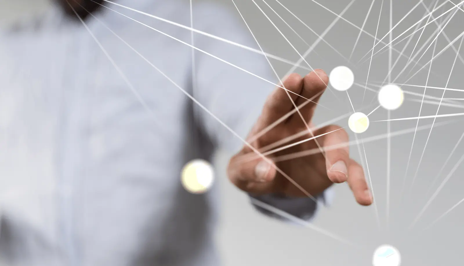 A hand touching an abstract network of interconnected points