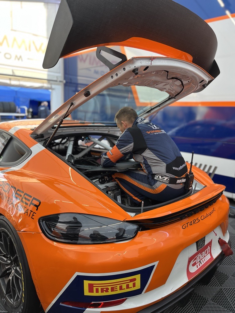 Racing driver sits in a racing car