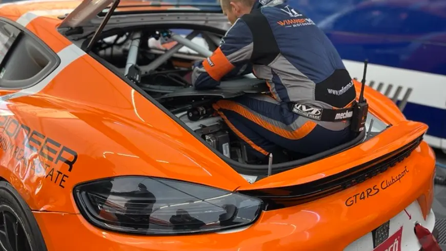 Racing driver sits in a racing car