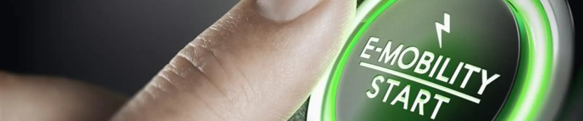 A finger about to press a green 'E-Mobility Start' button A finger about to press a green 'E-Mobility Start' button