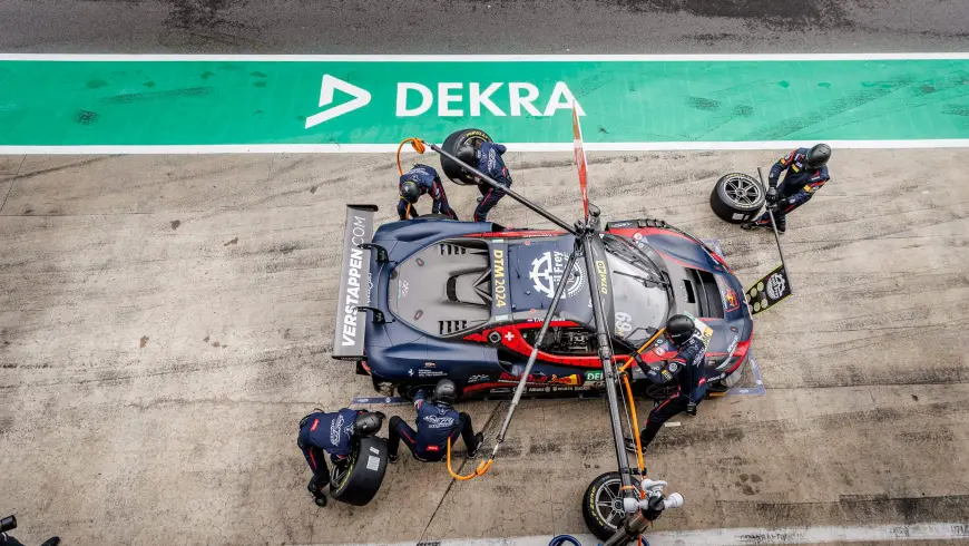DTM race car at pit stop with DEKRA asphalt
