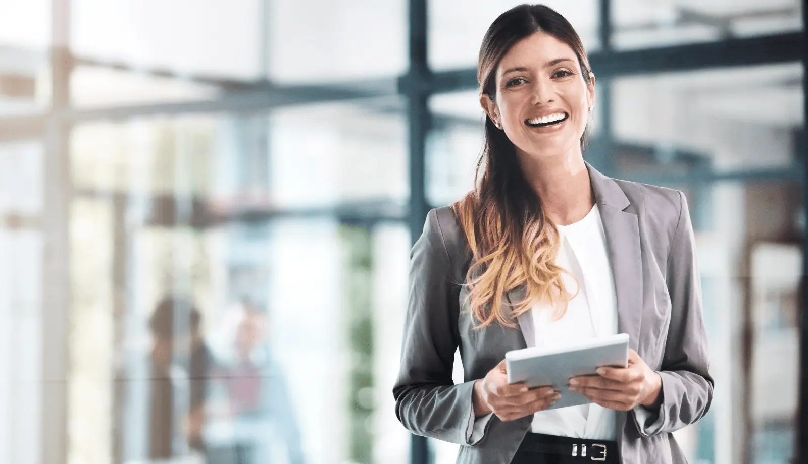 A woman holding an tablet
