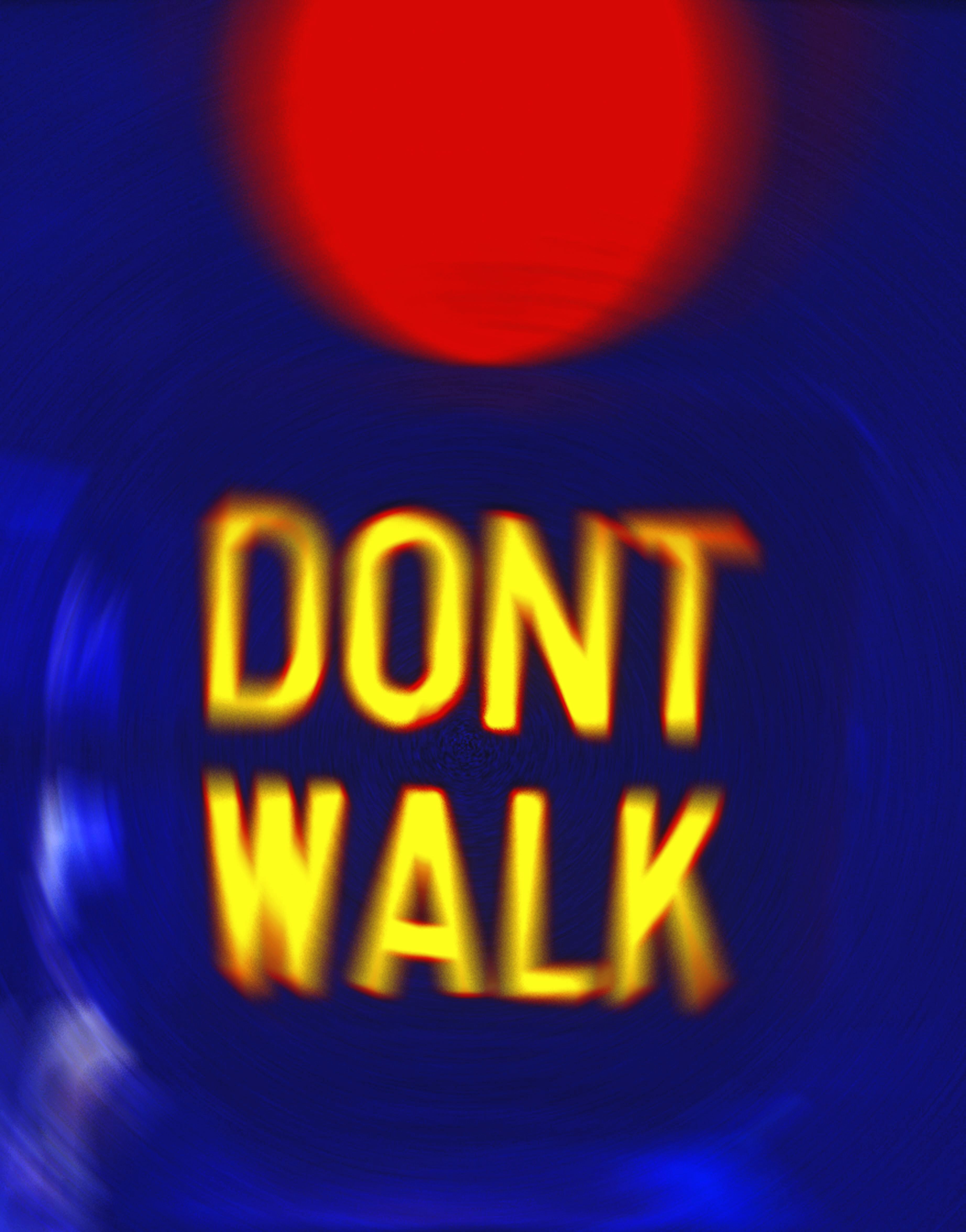 Pedestrian light with additional information prompting pedestrians to wait