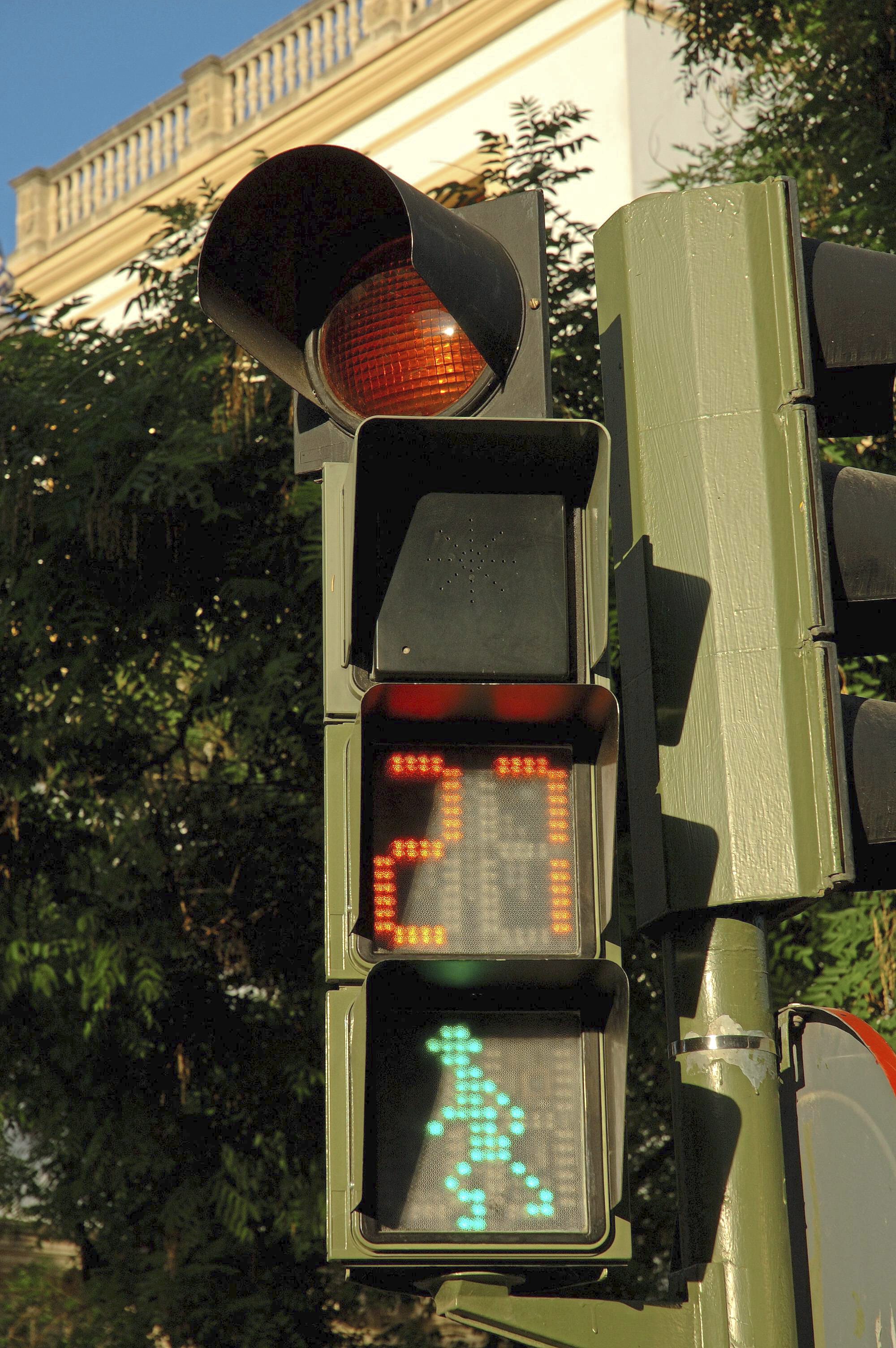 Pedestrian light with amber light informing pedestrians how much time they have left to cross the road