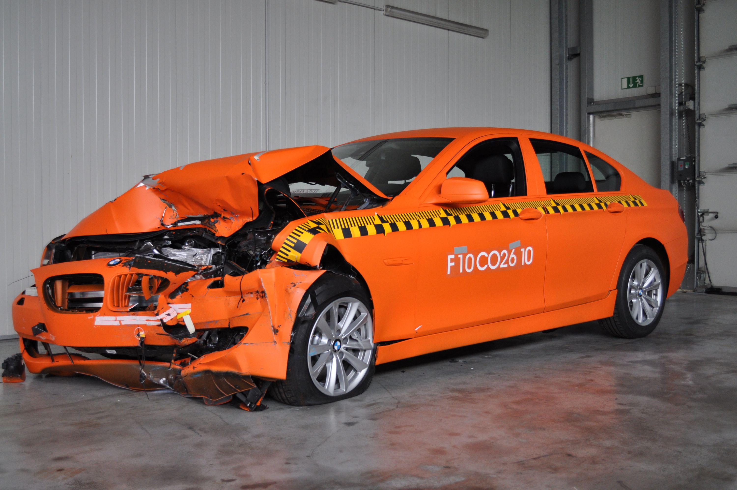 Accident examples - damage to the orange BMW  that crashed at 64 km/h