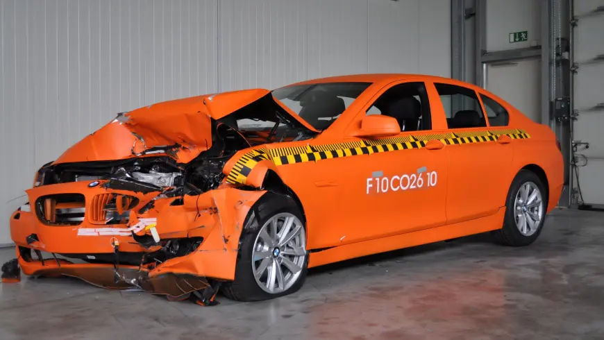 Accident examples - damage to the orange BMW  that crashed at 64 km/h