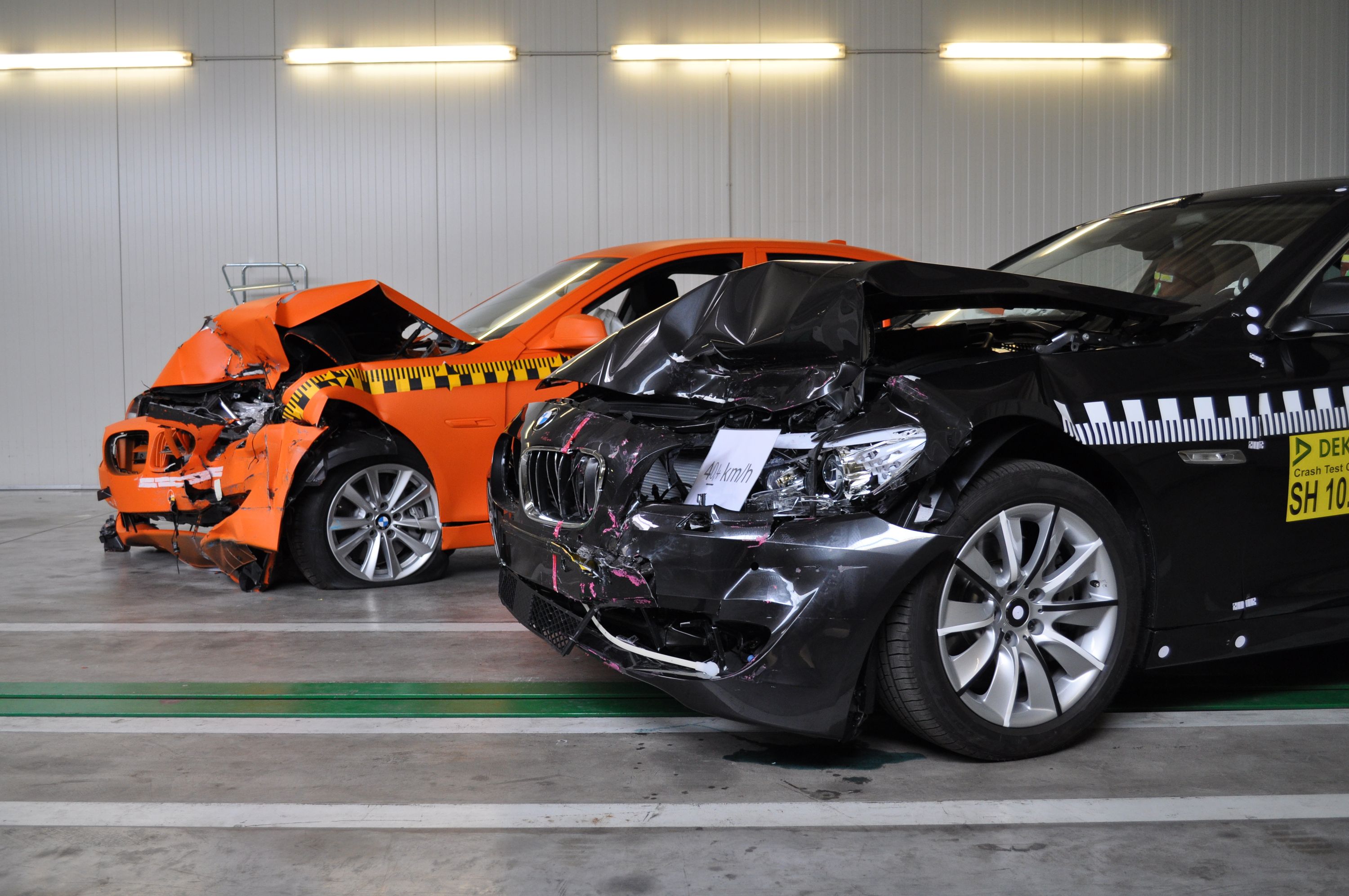 Accident examples - comparison of the different resulting damage between the orange and the black BMW