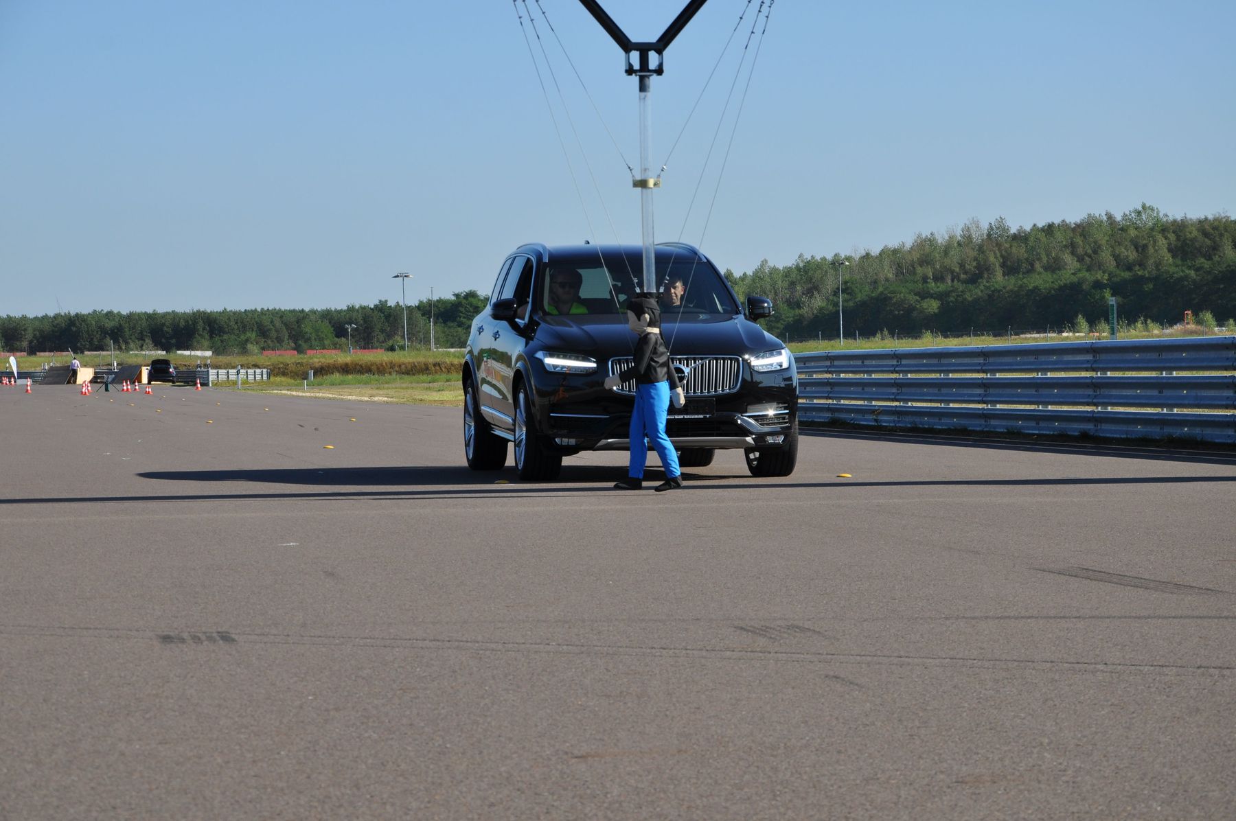Crash-test dummy in front of car