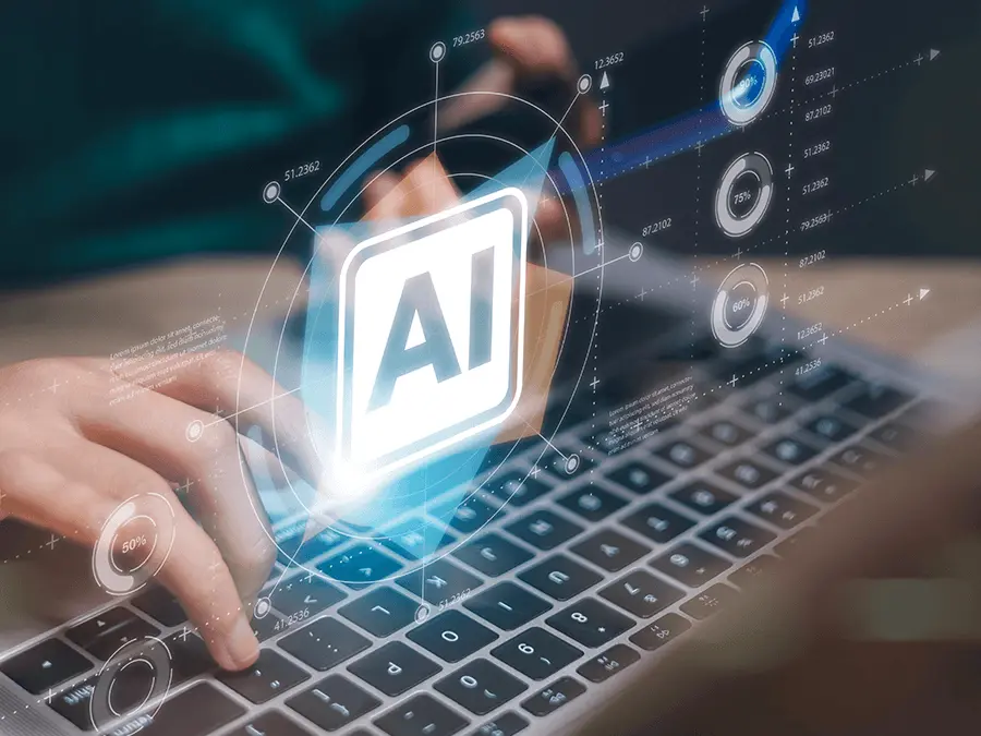 Ikona AI nad klawiaturą laptopa – zarządzanie systemami sztucznej inteligencji ISO/IEC 42001