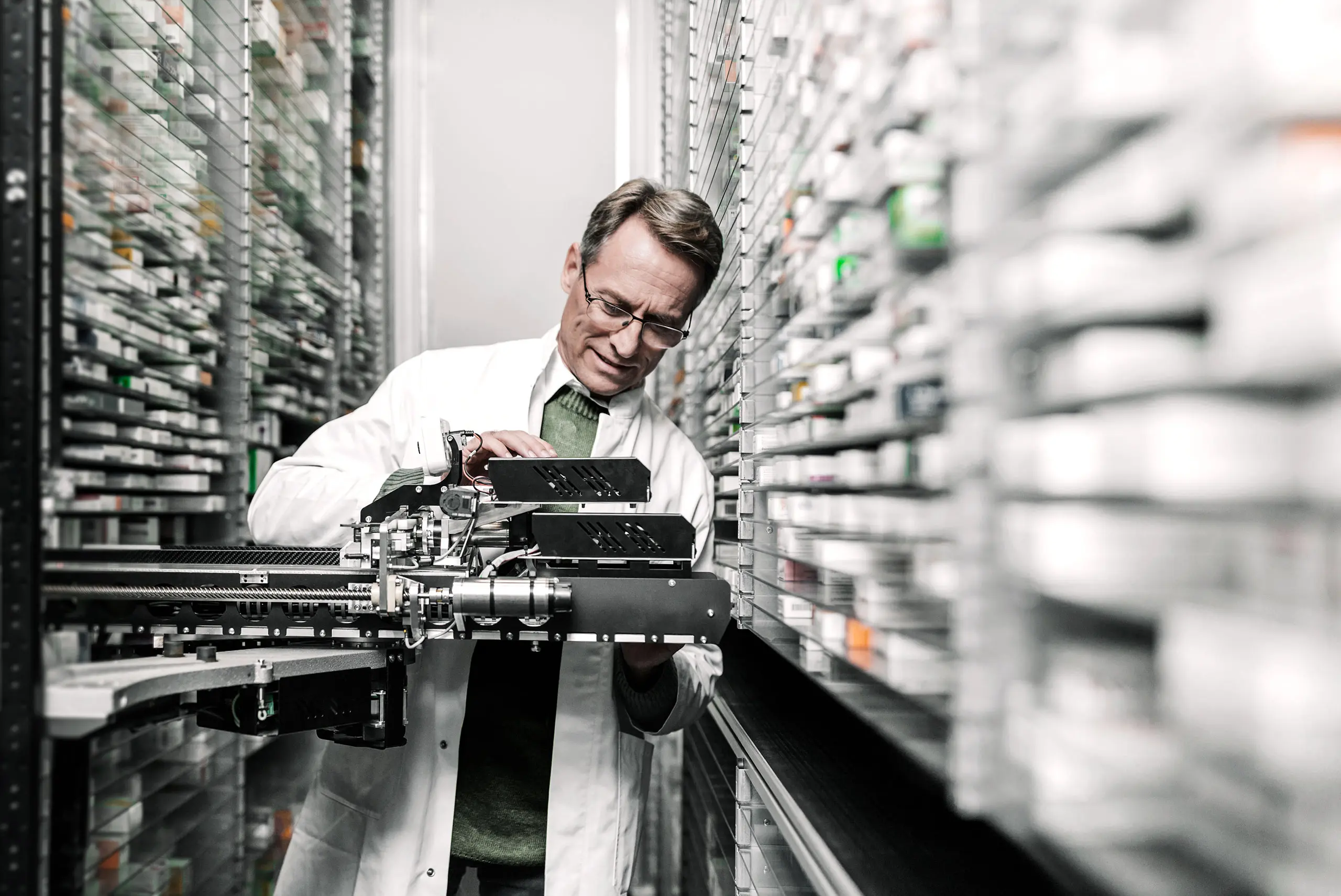 A pharmacist working with a device 