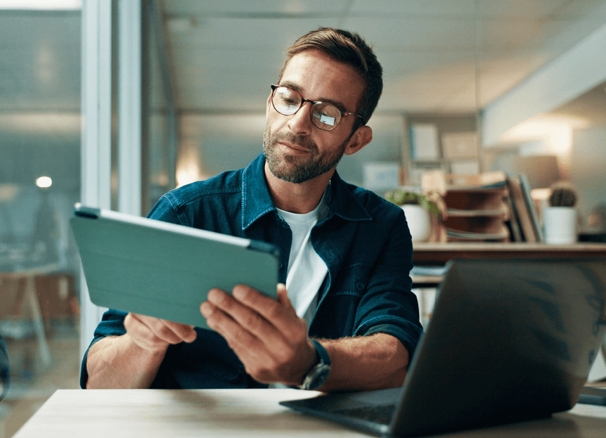 man looking at a tablet