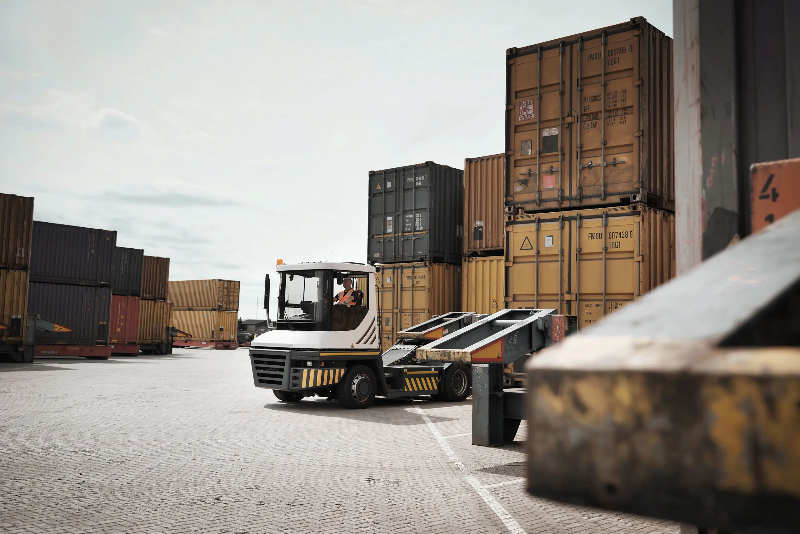 Forklift about to move containers