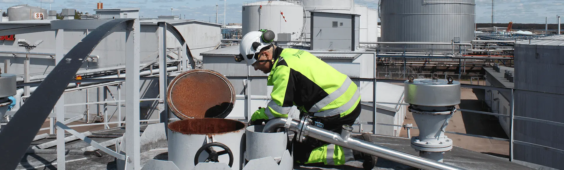 DEKRA Inspector on top of a tank