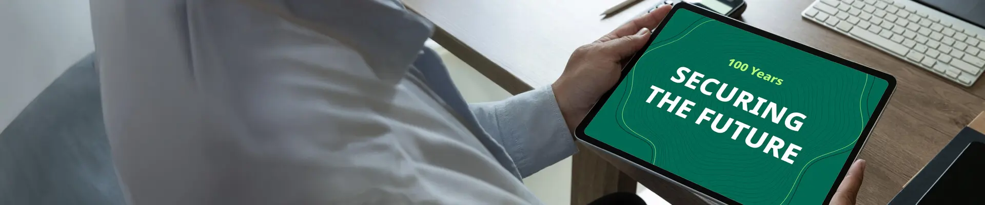 A person holding an ipad. A person holding an ipad.